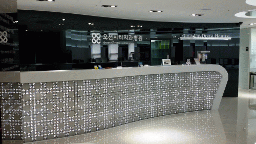 오션시티치과병원의 기업로고